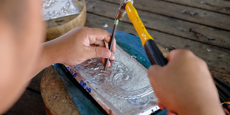 A man making silverware in chiangmai, Thai hand craft silverware