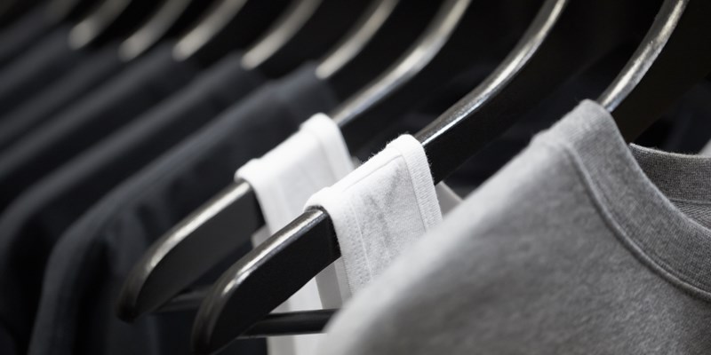 sports clothing on hangers, abstract background